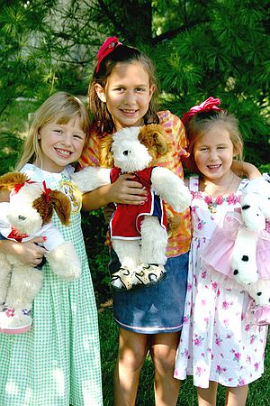 Kristen, Allison and Megan holding stuffed Dogs