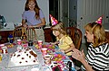 Kristen blowing out candles on Birthday Cake