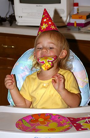 Rachel blowing on Party Favor